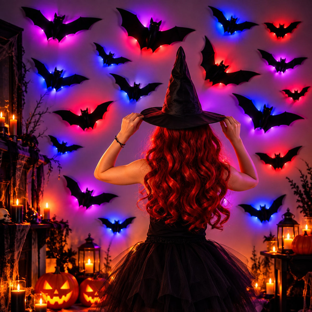 Woman in a witch hat standing in front of a wall of 3D Bat Lights