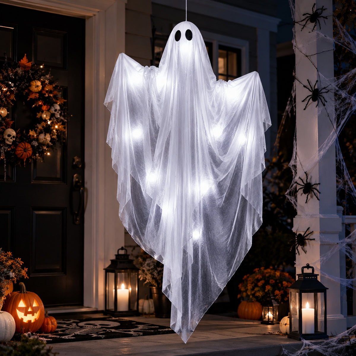 LED Hanging Ghost on a porch with lanterns, a wreath and spiders